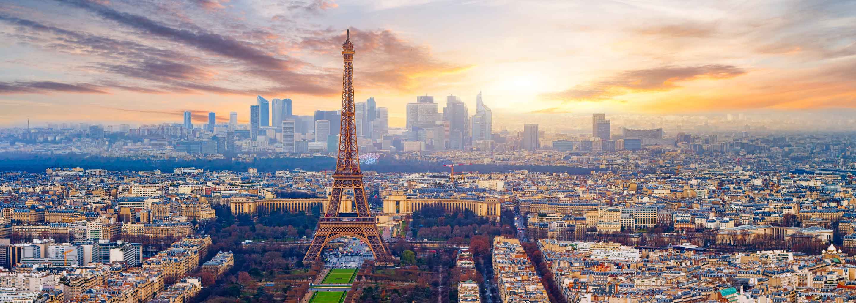 View over Paris with the Eiffel Tower around sunset.